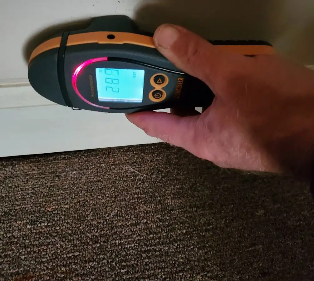Moisture detection at baseboard during Storm Damage Restoration in Fern Park